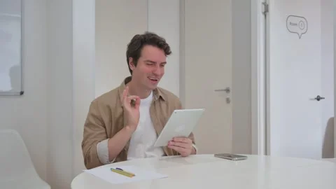 Vertical Video, Young Creative Man Using Digital Tablet for Video Chat Video stock 312914092