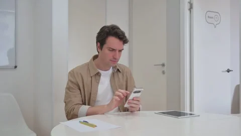 Vertical Video, Young Creative Man Reacting to Trading Loss on Phone Stock Footage 312914102