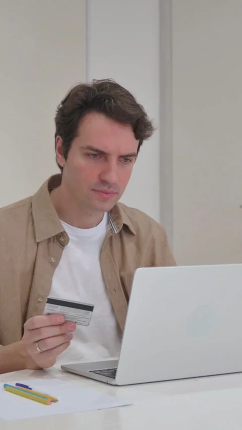 Vertical Video, Young Creative Man Reacting to Online Banking Failure on Laptop Video stock 318044995