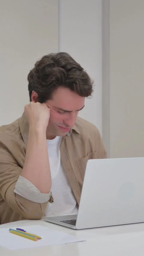 Vertical Video, Young Creative Man Sleeping in Front, Laptop Stock Footage 318045261