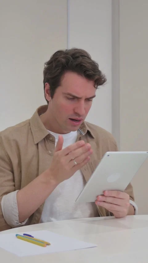 Vertical Video, Young Creative Man Celebrating Successful Business Report Stock Footage 318045542