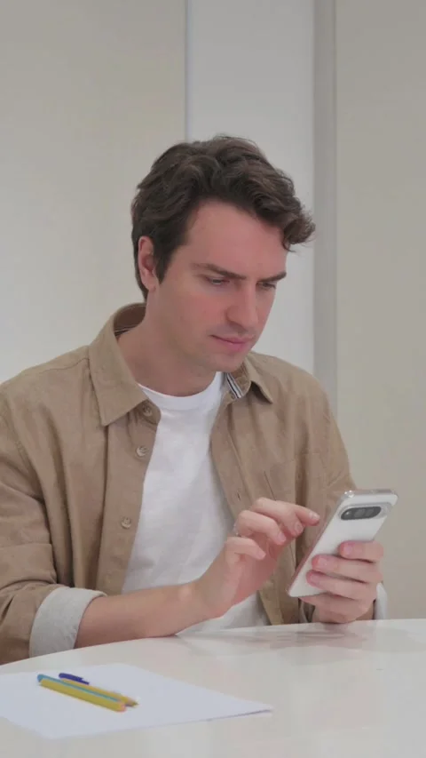 Vertical Video, Young Creative Man Reacting to Trading Loss on Phone Stock Footage 318045614