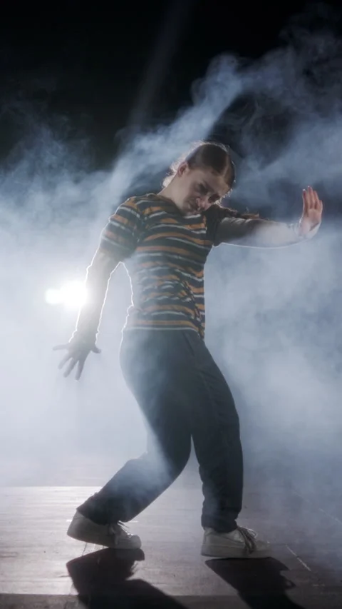 Vertical Video of young female dancer performing hip hop dance with strobe light Stock Footage 251556632