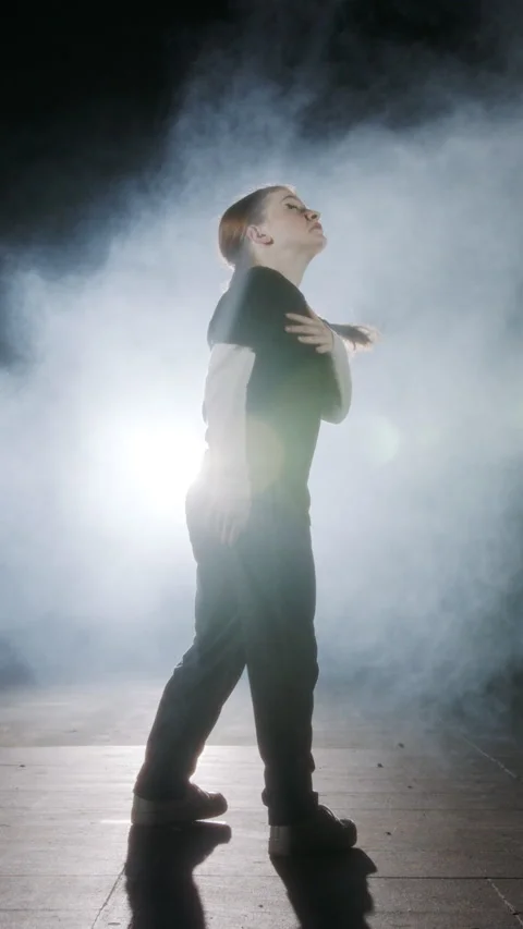 Vertical Video of young female dancer performing hip hop dance with strobe light Video stock 251556954
