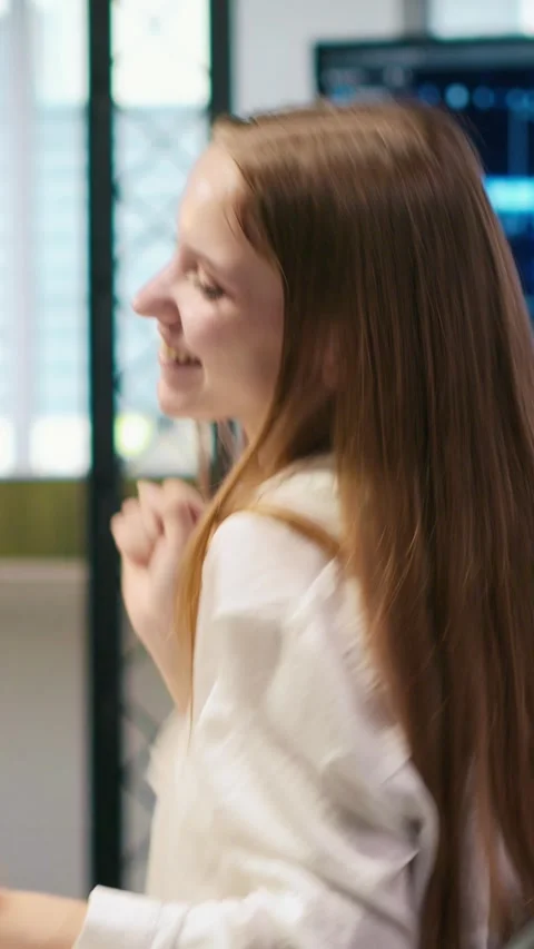Vertical video Young female programmer uses computer to write code, developing Stock Footage 312708173
