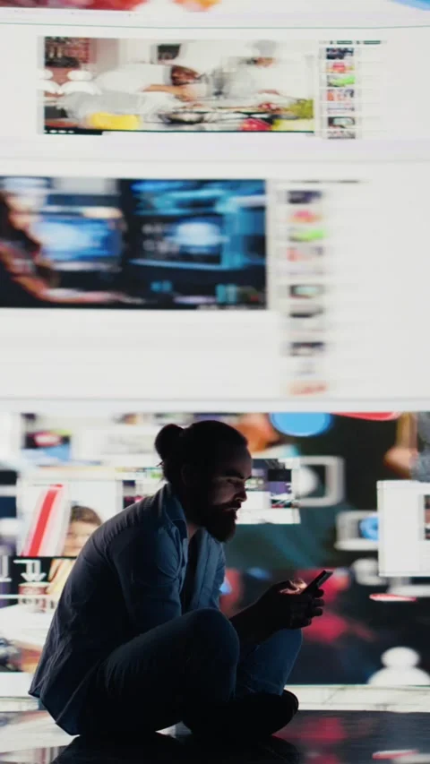 Vertical Video Young guy in misery is affected by anxiety and social depression Video stock 310702995