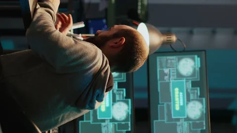 Vertical video: Young happy hacker celebrating coding achievement at night Stock Footage 222212602