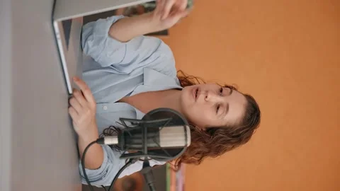 Vertical video - young host or creator for web and video content talking Stock Footage 221179960