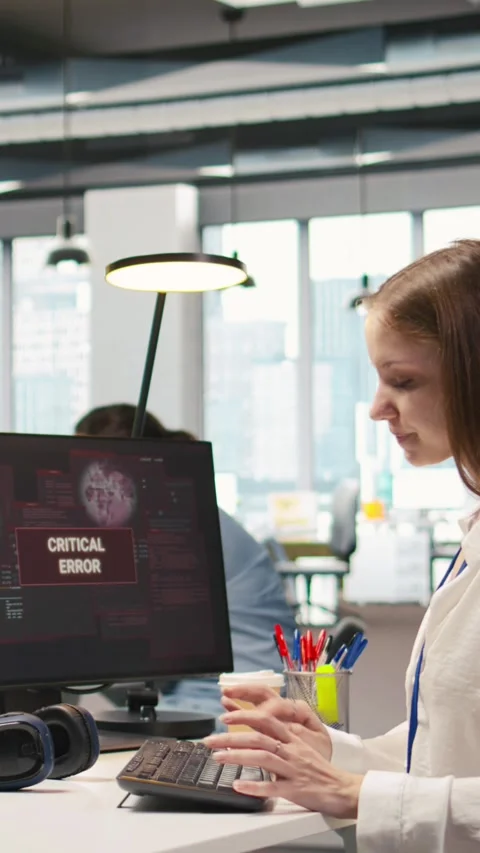 Vertical video Young inexperienced developer in office struggling to fix Stock Footage 312708528