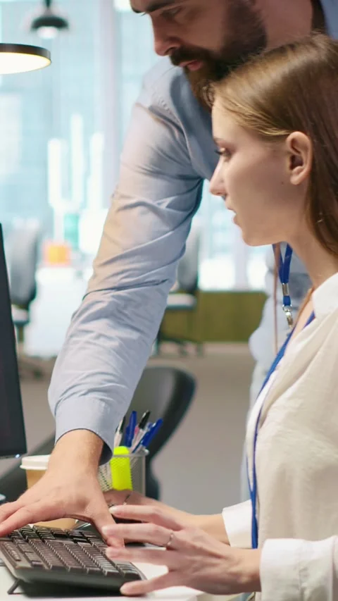 Vertical video Young inexperienced developer hacked in office requests help from Stock Footage 312708768