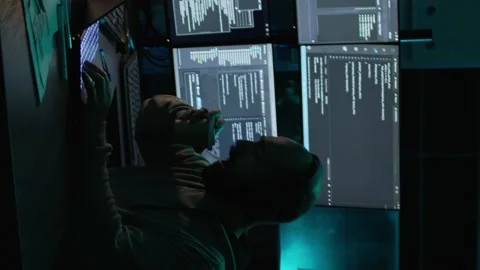 Vertical video: Young IT coder yawning and working on new interface Stock Footage 222213949