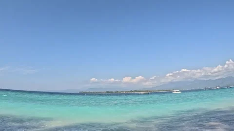 Vertical video of Young man admiring turquoise water on tropical beach Stock Footage 330574646