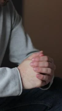 Vertical video Young man feels concerned due to bad life situation, debt or d 写真素材