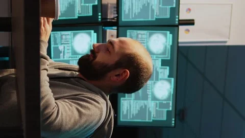 Vertical video: Young man hacking password to break server interface, Stock-Footage 222215130