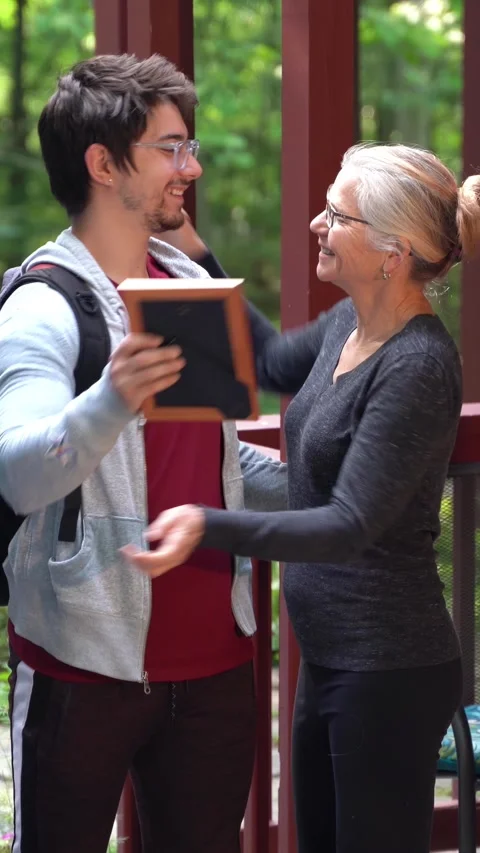 Vertical video of young man moving out of house leaving for college packing Video stock 248083098