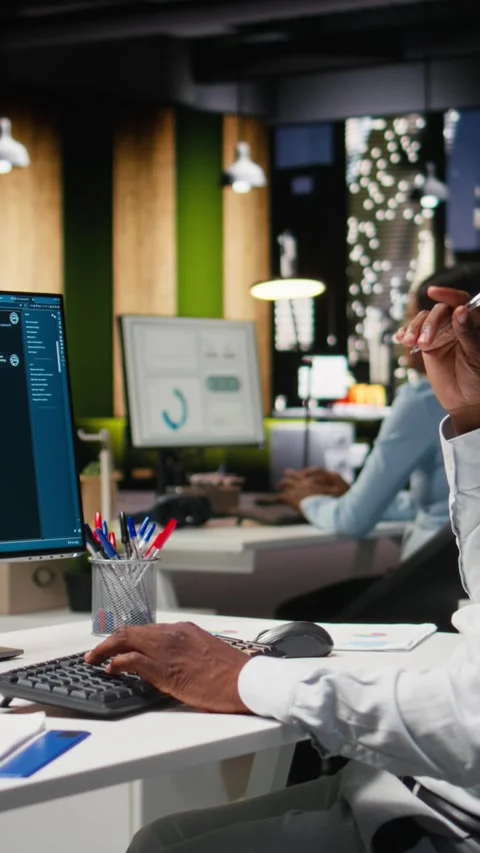 Vertical Video Young man PC user interacting with AI chat system on pc at office Stock Footage 318496843