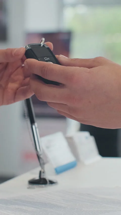 Vertical Video Young man selling car, handshake at car dealership Stock Footage 337882368