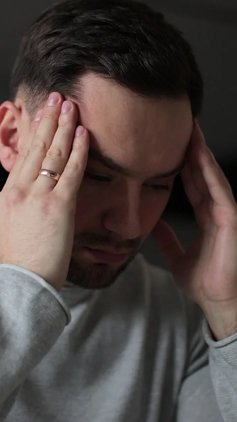 Vertical video Young man tired with hands on face physical and emotional Stock Footage 337649527