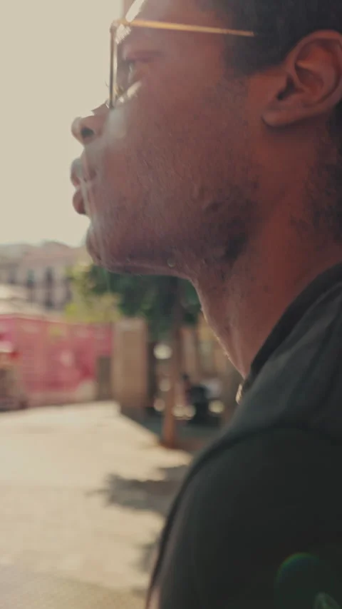 Vertical video, Young Man Walking Through City Square in Barcelona Stock Footage 319582874