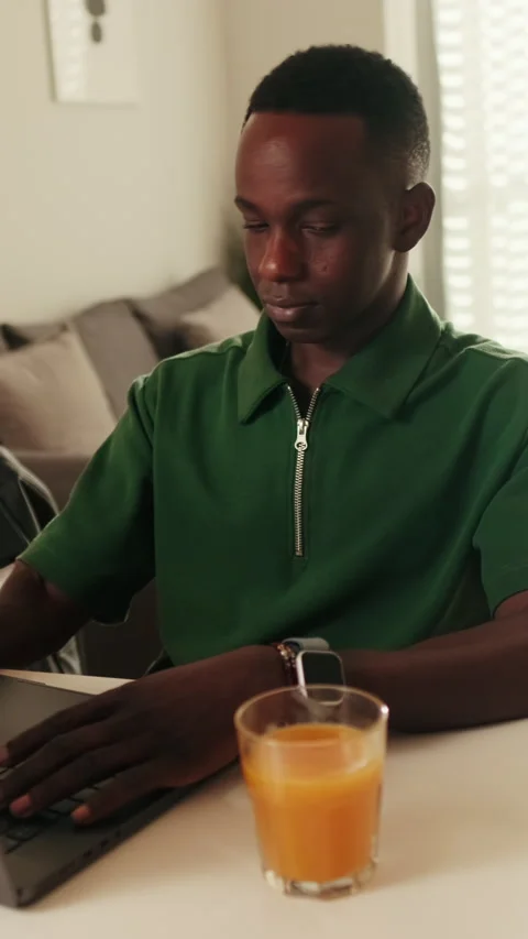 Vertical video, Young Man Working From Home on Laptop Stock Footage 312638967