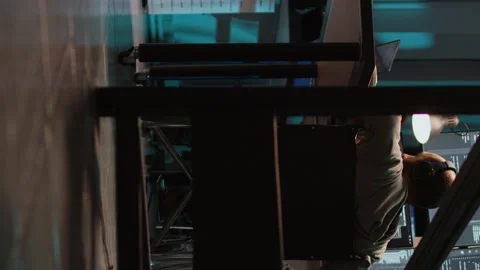 Vertical video: Young programmer with disability typing source code on terminal Stock Footage 221655451