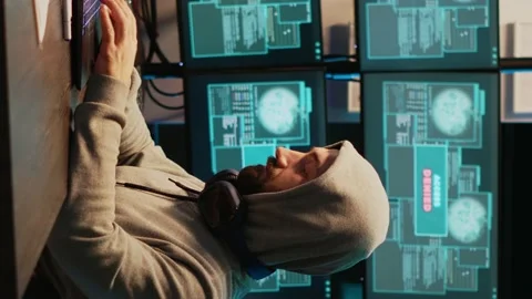 Vertical video: Young scammer trying to break database network Stock Footage 222209784