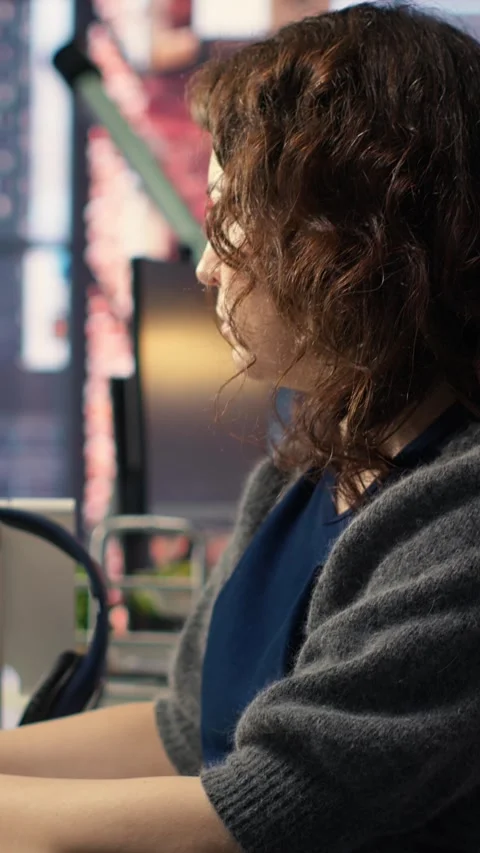 Vertical Video Young woman programming software code on her computer Stock Footage 308491561