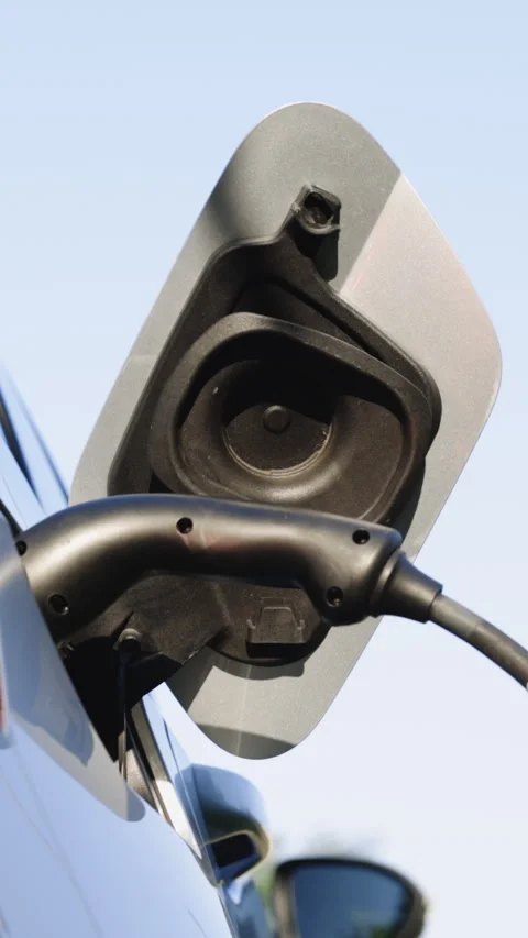 Vertical Video of Zero pollution vehicle with electronic engine. Charge auto at Stock Footage 306606954