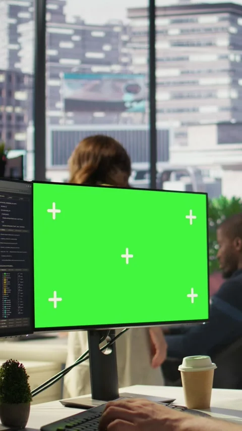 Vertical video Zoom in on mockup PC monitor used by IT expert in office 스톡 동영상 319478704