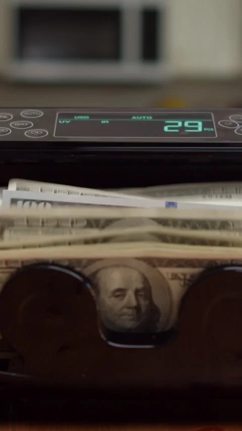 Vertical Video:Accurate Money Counter Processing Hundred Dollar Notes Smoothly Stock Footage 315686183