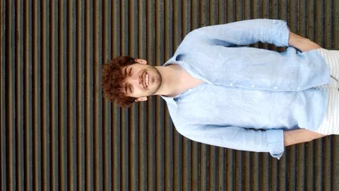 Vertical video.Portrait of a smiling attractive young Italian man Stock Footage 199310465
