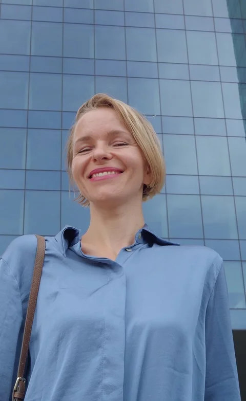 Vertical video.Portrait of a smiling young Ukrainian business woman Stock Footage 220824656