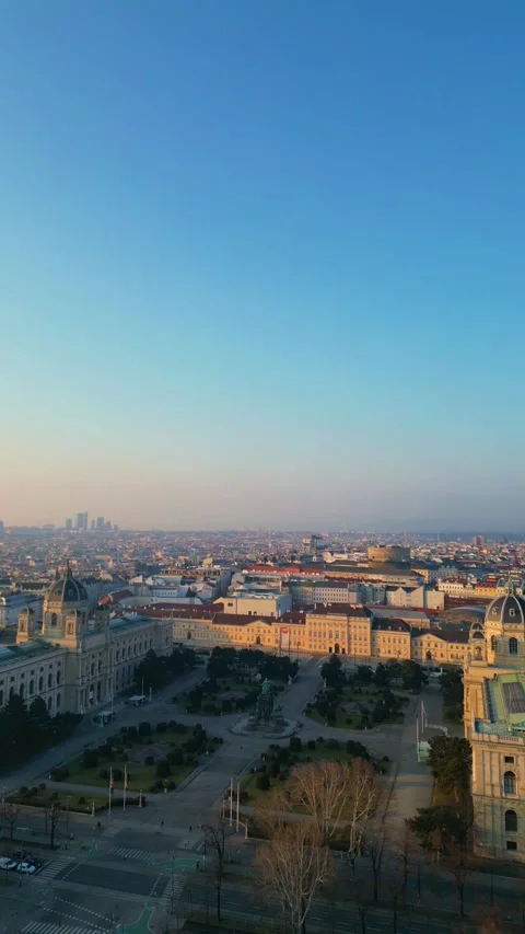 Vertical Vienna skyline changing colors during sunrise, aerial view Stock Footage 304180743