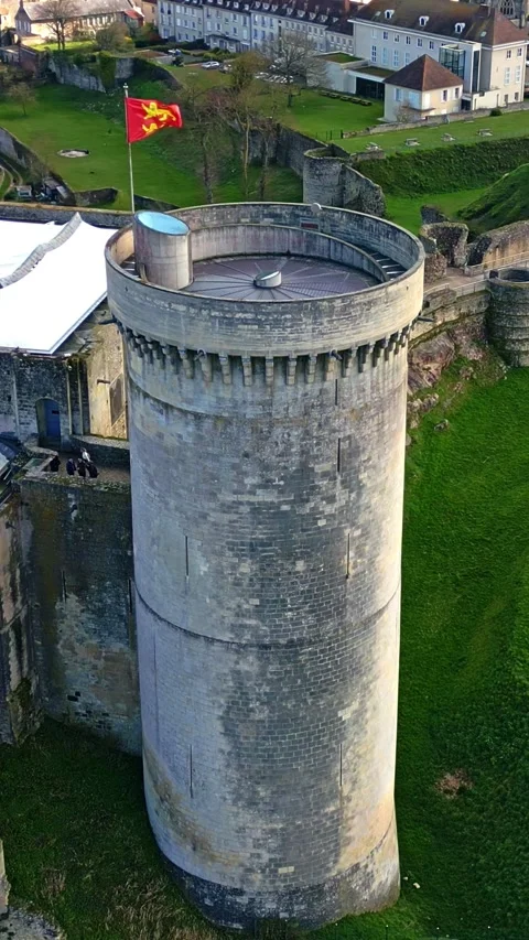 Vertical view about the round tower with local flag at William the Conqueror's Stock Footage 306291057