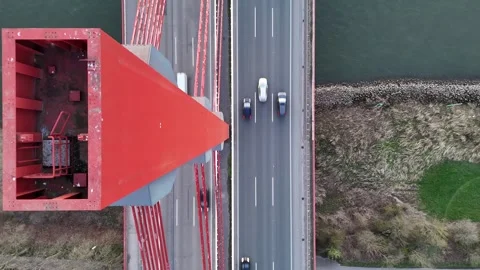 Vertical view along bridge tower down to traffic Stock Footage 331200144