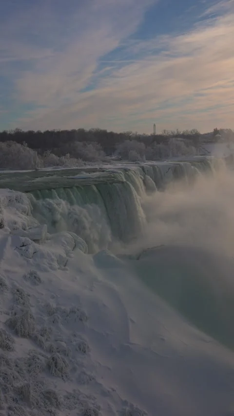 Vertical view of American Falls with turquoise water and winter mist Stock-Footage 342331202