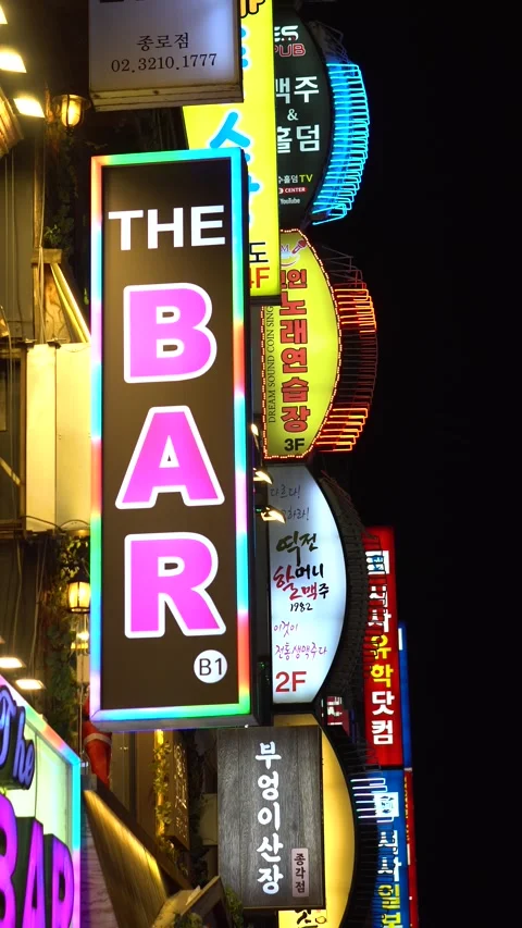 Vertical View of Bar and Restaurant Neon Signs at Night in Jongno District of Stock Footage 336259291