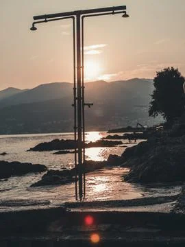 Vertical view of beach shower at sunset in Rijeka Stock Photos
