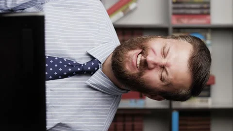 Vertical view bearded man flexes his facial muscles or makes funny face. Close Видео 133884312