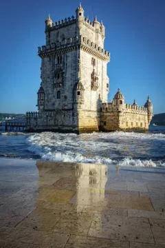 Vertical view of the Belem tower and reflection at the riverside of Tejo River Stock Photos