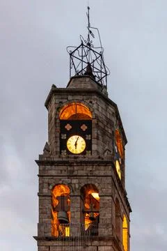 Vertical view of the bell tower Of the Church of Puebla de Sanabria with a su Stock Photos