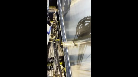 Vertical View of Bicycle Riding Up Moving Escalator Stock-Footage 345090812