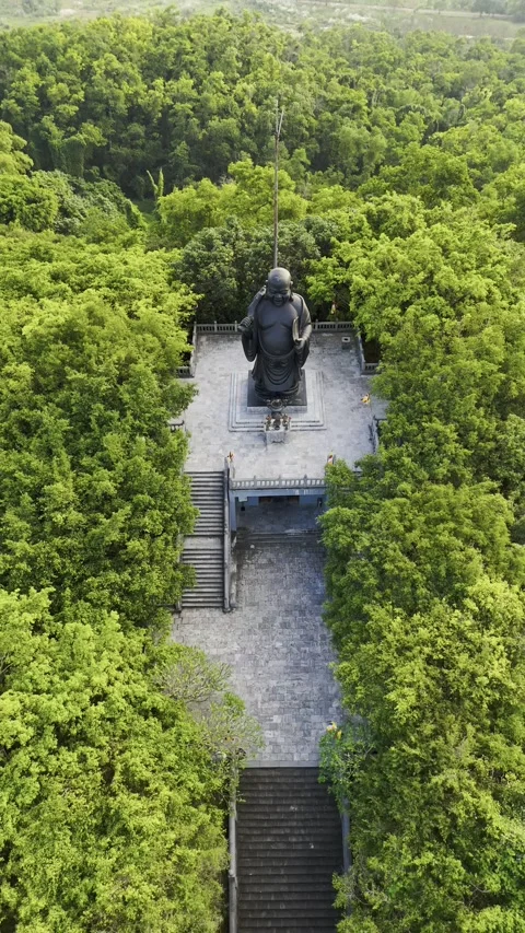 Vertical view of Black Buddha at Bai Dinh Pagoda, Ninh Binh, Vietnam – 4K Video stock 325040557