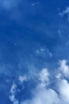 Vertical view of the blue sky with different types of clouds, at daytime Stock Photos