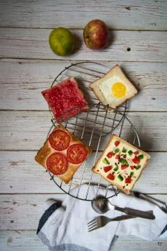 Vertical view of bread assortments with condiments Stock Photos