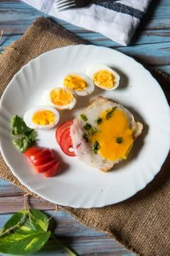 Vertical view of bread slice with poached egg Stock Photos
