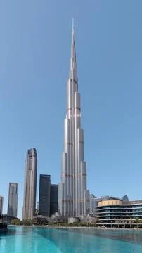 Vertical view of Burj Khalifa skyscraper and Burj Lake in Dubai Stock Photos