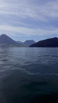 Vertical View of a Calm Alpine Mountain Lake, Switzerland Stock Photos