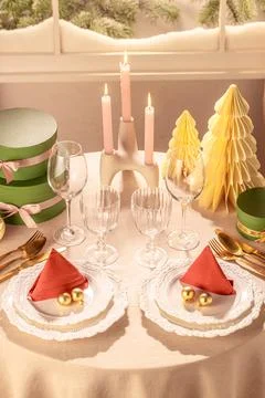 Vertical View Christmas Dining Table Setting for Two with Candles Stock Photos