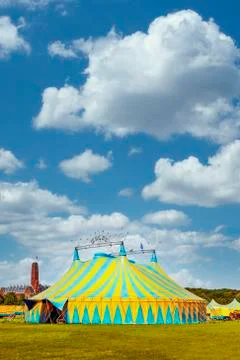 Vertical view of a circus tent under a warn sunset and chaotic sky 库存照片